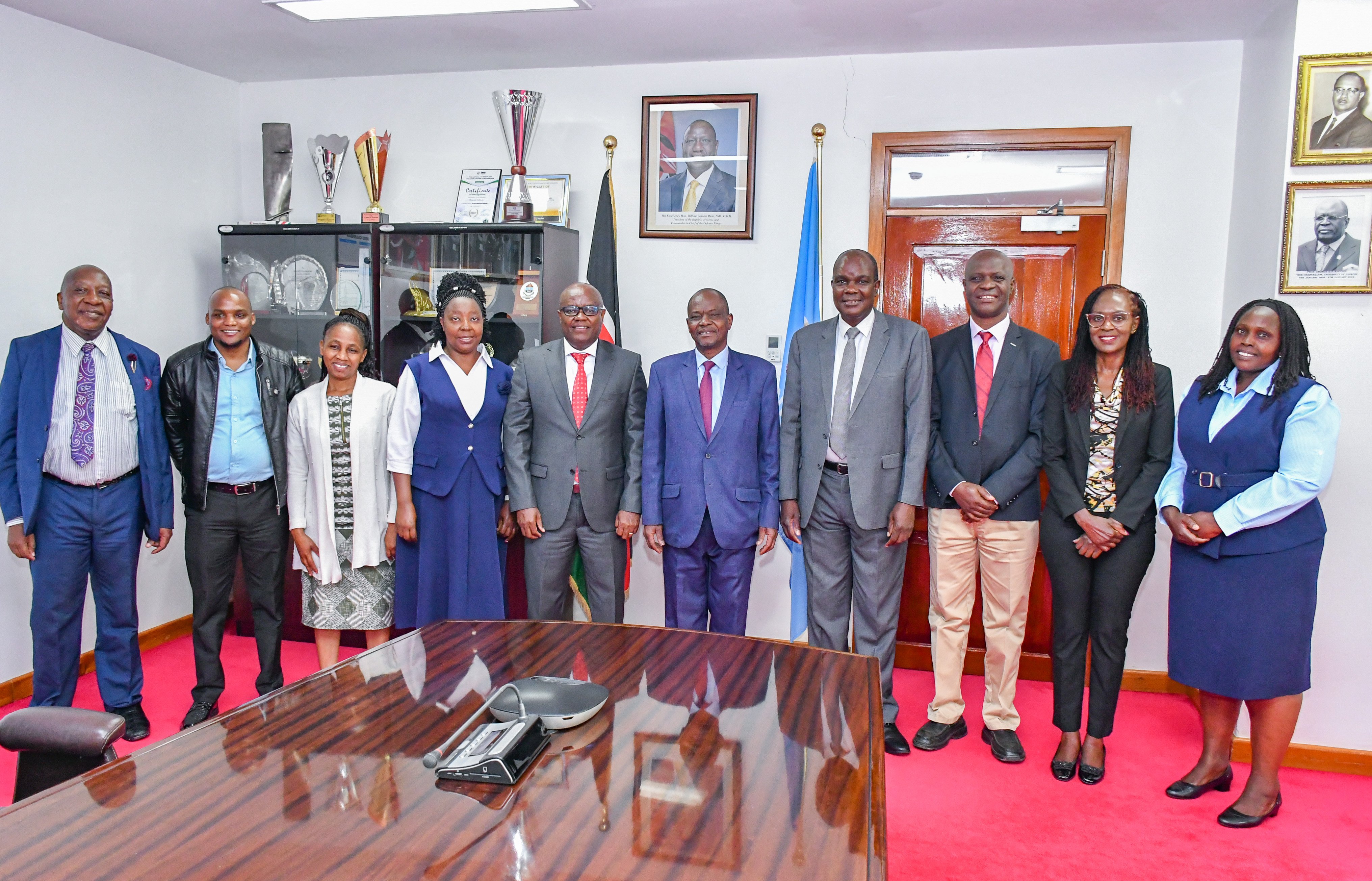 UoN VC Prof. Ayub Gitau, FHS Dean Prof. Daniel Ojuka and Mbagathi County Referral Hospital CEO, Dr. Alexander Irungu pose for a picture with FHS faculty staff. 