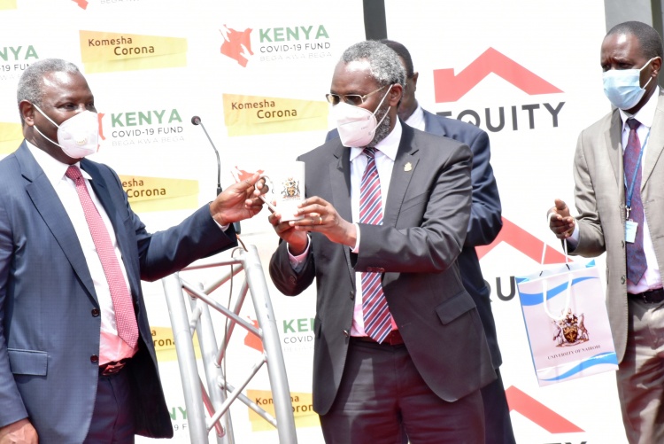 UoN Vice Chancellor, Prof. Stephen presents a gift to Dr James Mwangi Equity Group Managing Director and CEO.
