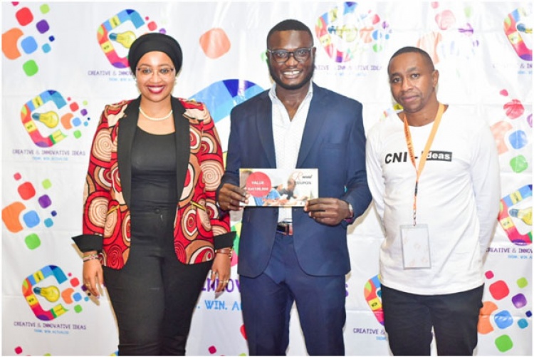 Mental Health Challenge winner Victor Baraza Wandera (C) with Ms Nadia Ahmed, Chief Administrative Secretary-Ministry of ICT, Innovations, and Youth Affairs (L).