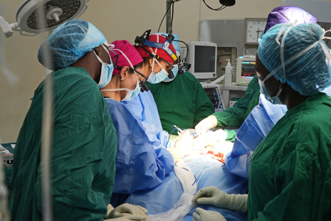 A team of doctors operating on a patient at Kenyatta National Hospital theater.