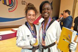 Sharon Wakoli(right) poses for a photo with her opponent in an international event.