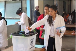 Medical student casting Votes during a past voting event