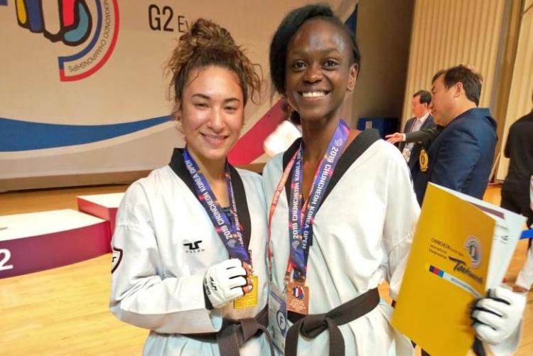 Sharon Wakoli(right) poses for a photo with her opponent in an international event.
