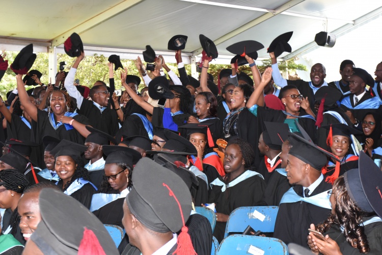 Graduands express happiness during graduation.