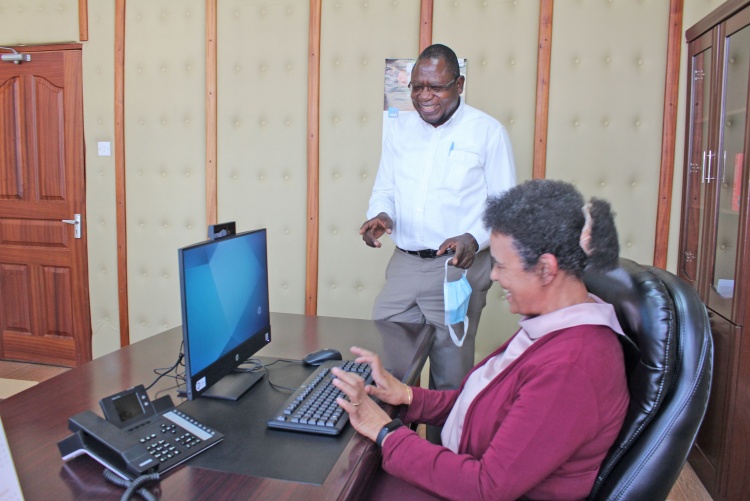     Prof. Julius Oyugi, Director Research, UNITID hands over computer donation to Prof. Evelyn Wagaiyu, Associate Dean Postgraduate.