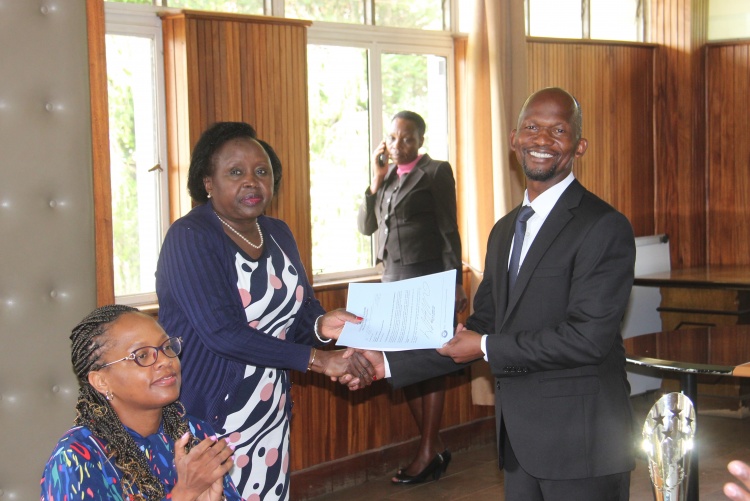 Faculty of Health Sciences Dean Prof. George Osanjo(R) with Prof. Eunice Cheserem, Chair Department of Obstetrics and Genecology during the signing of the 2022/2023 performance contract.