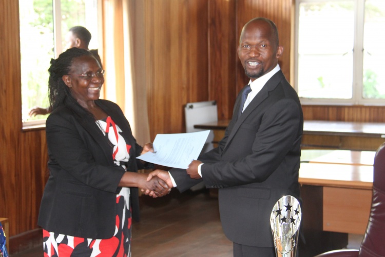 Faculty of Health Sciences Dean Prof. George Osanjo(R) with Prof. Joyce Olenja, Chair Department of Global Health during the signing of the 2022/2023 performance contract.