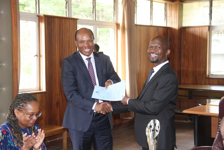 Faculty of Health Sciences Dean Prof. George Osanjo(R) with Dr. Julius Kiboi, Chair Department of Surgery during the signing of the 2022/2023 performance contract.