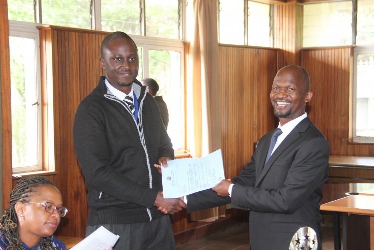 Faculty of Health Sciences Dean Prof. George Osanjo(R) with Dr. Eric Guantai, Chair Department of Pharmacy during the signing of the 2022/2023 performance contract.