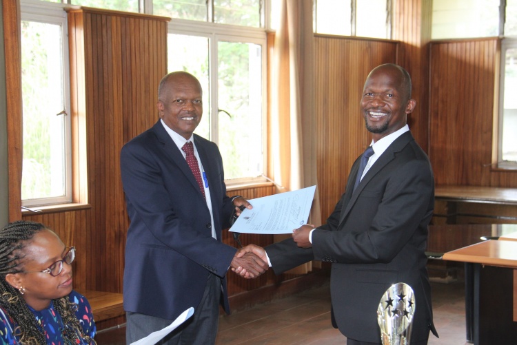 Faculty of Health Sciences Dean Prof. George Osanjo(R) with Dr. Stephen Gichuhi, Chair Department of Ophthalmology during the signing of the 2022/2023 performance contract.