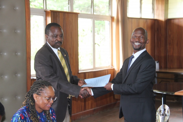 Faculty of Health Sciences Dean Prof. George Osanjo(R) with Prof. Erastus Amayo, Chair Department of Clinical Medicine during the signing of the 2022/2023 performance contract.