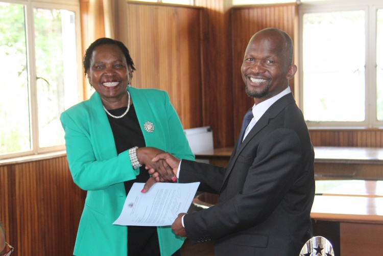 Faculty of Health Sciences Dean Prof. George Osanjo(R) with Dr. Grace Irimu, Chair Paediatrics and Child Care during the  signing of the 2022/2023 performance contract.