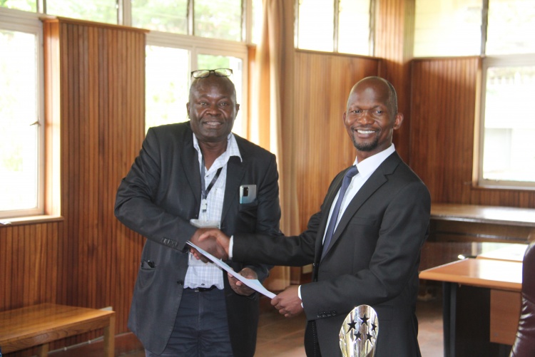 Faculty of Health Sciences Dean Prof. George Osanjo(R) with Prof. C F Otieno, Associate Dean Faculty of Health Sciences during the signing of the 2022/2023 performance contract.