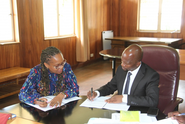 Faculty of Health Sciences Dean Prof. George Osanjo(R) with Dr. Marriann Mureithi, Chair Department of Medical Microbiology and Immunology during the signing of the 2022/2023 performance contract.