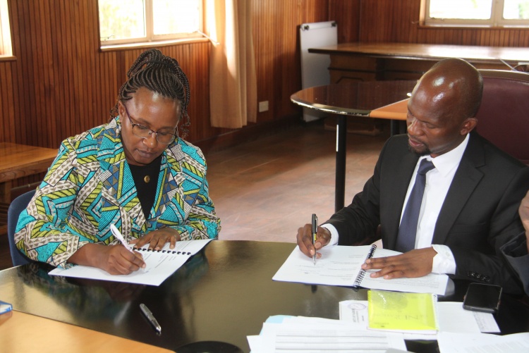 Faculty of Health Sciences Dean Prof. George Osanjo(R) with Prof. Anne Matheka, Chair Department of Nursing during the signing of the 2022/2023 performance contract.