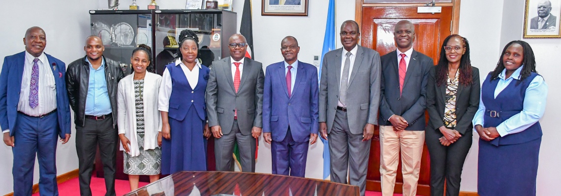 UoN VC Prof. Ayub Gitau, FHS Dean Prof. Daniel Ojuka and Mbagathi County Referral Hospital CEO, Dr. Alexander Irungu pose for a picture with FHS faculty staff. 