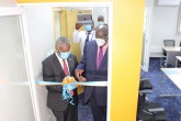 Education Cabinet Secretary Prof. George Magoha(R) and University of Nairobi Vice Chancellor Prof. Stephen Kiama cut the ribbon to officially open the CEMA Data Science Lab.