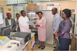 CRISSP+ Principal Investigator Dr. Jared Mecha handing over laboratory equipment to CEC Health - Kiambu County at Kiambu Level 4 Hospital.