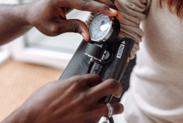 A picture of a patients blood pressure being  taken.